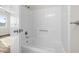 Bright bathroom with white bathtub and shower combination at 1100 Possum Trot Rd. # E235, North Myrtle Beach, SC 29582