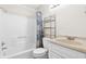 Bathroom with white tub/shower, vanity, and decorative shower curtain at 1100 Possum Trot Rd. # E235, North Myrtle Beach, SC 29582
