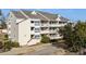 Exterior view of a multi-story condo building with balconies at 1100 Possum Trot Rd. # E235, North Myrtle Beach, SC 29582