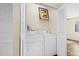 Compact laundry room with a stacked washer and dryer unit at 1100 Possum Trot Rd. # E235, North Myrtle Beach, SC 29582