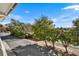 View from the balcony includes lush landscaping and nearby tennis courts at 1100 Possum Trot Rd. # E235, North Myrtle Beach, SC 29582