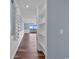 Hallway with wood floors and built-in shelving units at 1213 S Ocean Blvd. # 103, Surfside Beach, SC 29575