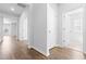 Bright hallway with hardwood floors and doors to other rooms at 1233 Nw Calabash Station Blvd., Calabash, NC 28467