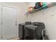 Laundry room with washer, dryer, and overhead shelving at 154 Southgate Ct., Pawleys Island, SC 29585