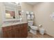 Bathroom with granite vanity, toilet, and towel rack at 2100 North Ocean Blvd. # 923, North Myrtle Beach, SC 29582