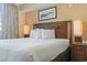 King-size bed with white bedding and nightstands at 2100 North Ocean Blvd. # 923, North Myrtle Beach, SC 29582
