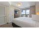Bedroom with a king-size bed, TV, and balcony access at 2100 North Ocean Blvd. # 923, North Myrtle Beach, SC 29582