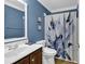 Clean bathroom with a shower/tub combo and floral shower curtain at 2137 N Berwick Dr., Myrtle Beach, SC 29575