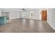 Living area with tiled floors, a ceiling fan, multiple windows, and an entryway at 2231 Flora St., Georgetown, SC 29440