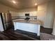 Kitchen with island and stainless steel appliances at 231 Linares St., Loris, SC 29569