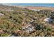 Modern coastal home nestled among trees near the beach at 239 Coachman Dr., Pawleys Island, SC 29585