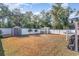 Fenced backyard with shed, coop, hammock, and grill at 239 Coachman Dr., Pawleys Island, SC 29585