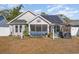 Backyard with hammock, screened porch, and solar panels at 239 Coachman Dr., Pawleys Island, SC 29585