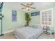 Inviting bedroom with green walls, ceiling fan, and large bed at 239 Coachman Dr., Pawleys Island, SC 29585