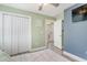 Bedroom featuring two-tone walls, closet doors, and an exit door at 239 Coachman Dr., Pawleys Island, SC 29585