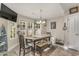 Cozy dining space with natural light, a table, chairs, and a bench at 239 Coachman Dr., Pawleys Island, SC 29585