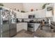 Well-equipped kitchen with stainless steel appliances, ample counter space, and white cabinets at 239 Coachman Dr., Pawleys Island, SC 29585