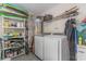 Laundry room with washer, dryer, and storage shelves at 239 Coachman Dr., Pawleys Island, SC 29585