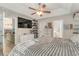 Large Primary bedroom with a spacious layout, ceiling fan, and ensuite bathroom access at 239 Coachman Dr., Pawleys Island, SC 29585