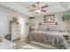 Relaxing main bedroom with a comfortable bed, ceiling fan, and ample storage at 239 Coachman Dr., Pawleys Island, SC 29585
