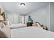 Two beds, dresser, and TV in a condo bedroom at 2600 North Ocean Blvd. # 211, Myrtle Beach, SC 29577