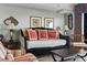 Living room featuring a black daybed with red pillows at 2600 North Ocean Blvd. # 211, Myrtle Beach, SC 29577
