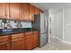 Modern kitchen with granite countertops and wood cabinets at 2600 North Ocean Blvd. # 211, Myrtle Beach, SC 29577