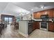 Modern kitchen featuring stainless steel appliances and dark wood cabinetry at 2600 North Ocean Blvd. # 211, Myrtle Beach, SC 29577