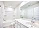 White bathroom with shower, tub, toilet, and large mirror at 268 Empyrean Circle, Myrtle Beach, SC 29588