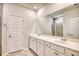 Modern bathroom with dual vanity sinks, white cabinets, and a large mirror at 268 Empyrean Circle, Myrtle Beach, SC 29588