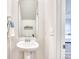 Half bathroom with a pedestal sink, mirror, and modern fixtures at 268 Empyrean Circle, Myrtle Beach, SC 29588
