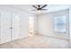 Spacious bedroom with two doors, ceiling fan, and window at 268 Empyrean Circle, Myrtle Beach, SC 29588