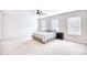 Spacious bedroom with neutral carpet, ceiling fan, and windows at 268 Empyrean Circle, Myrtle Beach, SC 29588