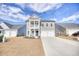 Charming two-story home with a two-car garage and a small front porch at 268 Empyrean Circle, Myrtle Beach, SC 29588