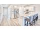 Kitchen island with seating, white cabinets, and stainless steel appliances at 268 Empyrean Circle, Myrtle Beach, SC 29588