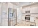 White kitchen with stainless steel appliances, granite countertops, and ample storage at 268 Empyrean Circle, Myrtle Beach, SC 29588