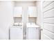 Laundry room with Samsung washer and dryer and overhead cabinets at 268 Empyrean Circle, Myrtle Beach, SC 29588