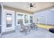 Screened porch with seating and ceiling fan at 268 Empyrean Circle, Myrtle Beach, SC 29588