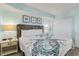 Cozy bedroom with beach-themed decor and a comfortable bed at 2801 S Ocean Blvd. # 1237, North Myrtle Beach, SC 29582