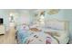 Two twin beds in a bedroom with an ocean theme and an ensuite bathroom at 2801 S Ocean Blvd. # 1237, North Myrtle Beach, SC 29582