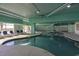 Indoor pool area with lounge chairs and natural light at 2801 S Ocean Blvd. # 1237, North Myrtle Beach, SC 29582