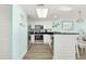 Modern kitchen with stainless steel appliances and light blue walls at 2801 S Ocean Blvd. # 1237, North Myrtle Beach, SC 29582