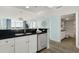 View of the kitchen featuring white cabinetry, dark countertops, and stainless steel appliances at 2801 S Ocean Blvd. # 1237, North Myrtle Beach, SC 29582