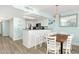Bright kitchen with white cabinets, breakfast bar, and dining area at 2801 S Ocean Blvd. # 1237, North Myrtle Beach, SC 29582