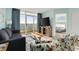 Living room with a gray sofa, colorful armchairs, a coffee table, and ocean views at 2801 S Ocean Blvd. # 1237, North Myrtle Beach, SC 29582