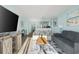 Living room with a gray sofa, colorful chairs, a coffee table, and views of the dining area at 2801 S Ocean Blvd. # 1237, North Myrtle Beach, SC 29582