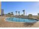 Oceanfront outdoor pool with lounge chairs and palm trees at 2801 S Ocean Blvd. # 1237, North Myrtle Beach, SC 29582
