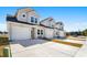 Three attached townhouses with gray siding, white trim, and two-car garages at 351 Brackish Dr. # 351, Myrtle Beach, SC 29588