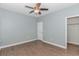 Bedroom with hardwood floors, ceiling fan, and walk-in closet at 360 Hillsborough Dr., Conway, SC 29526
