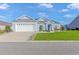 Newly built home with a two-car garage and well-manicured lawn at 360 Hillsborough Dr., Conway, SC 29526